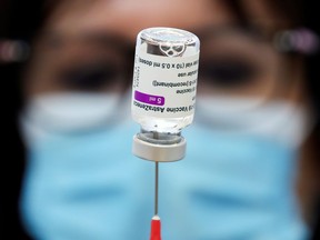 A medical worker prepares a dose of the AstraZeneca vaccine.