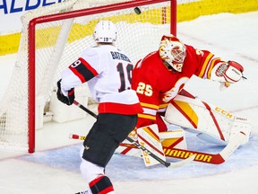 Mar 7, 2021; Calgary, Alberta, CAN; Ottawa Senators right wing Drake Batherson (19) scores a goal against Calgary Flames goaltender Jacob Markstrom (25) during the shootout at Scotiabank Saddledome.