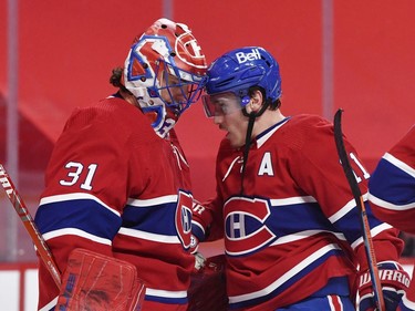 Canadiens goalie Carey Price (31) receives a friendly head butt from teammate Brendan Gallagher after Tuesday's win over the Senators in Montreal.