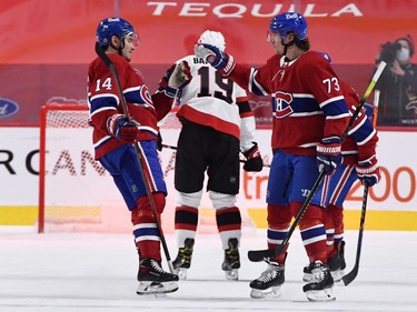 Canadiens forward Tyler Toffoli (73) celebrates with teammate Nick Suzuki after scoring the empty-net goal against the Senators on Tuesday night.
