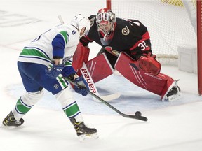 Vancouver Canucks centre J.T. Miller shoots on Ottawa Senators goalie Filip Gustavsson in overtime at the Canadian Tire Centre.