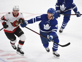 Ottawa Senators forward Josh Norris (left) and Toronto Maple Leafs forward Pierre Engvall at Scotiabank Arena, Feb. 18, 2021.