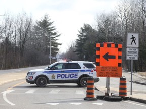 Renaud Road remained closed to traffic Thursday for a police investigation into a suspected marijuana grow-op and clandestine lab
