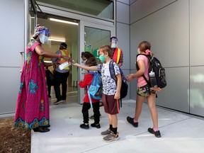 File photo/ Teachers and students outside École Horizon-Jeunesse in Ottawa.