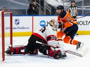 The Edmonton Oilers' Leon Draisaitl (29) scores a goal on Ottawa Senators' goaltender Matt Murray (30) during first period NHL action at Rogers Place in Edmonton, on Wednesday, March 10, 2021.