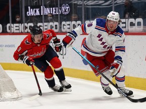 Brendan Lemieux still with the New York Rangers skates past Dmitry Orlov of the Washington Capitals  on March 19, 2021.