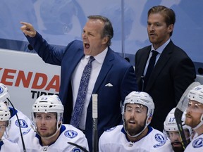 Tampa Bay Lightning heat coach Jon Cooper reacts from the bench during a game last year.