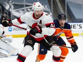 Ottawa Senators' Erik Gudbranson battles with Edmonton Oilers' Patrick Russell during first period NHL action at Rogers Place in Edmonton, on Wednesday, March 10, 2021.