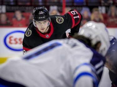 Ottawa Senators right wing Drake Batherson (19) eyes there face-off during first period NHL action against the Winnipeg Jets at the Canadian Tire Centre.