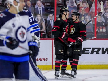 Ottawa Senators left wing Brady Tkachuk (7) in congratulated on his goal against the Winnipeg Jets by teammate Ottawa Senators center Josh Norris (9) during first period NHL action at the Canadian Tire Centre.