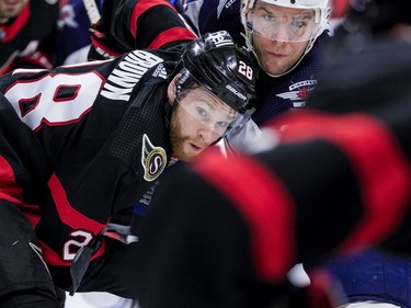 -OTTAWA- April 12,2021. Ottawa Senators right wing Connor Brown (28) and Winnipeg Jets center Paul Stastny (25) battle in the face-off circle during second period NHL action at the Canadian Tire Centre. ERROL MCGIHON/Postmedia25\