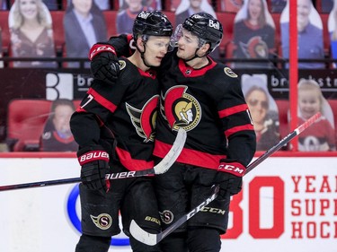 -OTTAWA- April 12,2021. Ottawa Senators left wing Brady Tkachuk (7) and Ottawa Senators right wing Drake Batherson (19) celebrate their teams victory over the Winnipeg Jets at the Canadian Tire Centre. ERROL MCGIHON/Postmedia