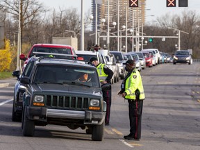 The Ottawa Police Service screen travellers entering Ontario from Quebec on the Champlain Bridge in support of public health orders issued by the Government of Ontario. Monday, Apr. 19, 2021.