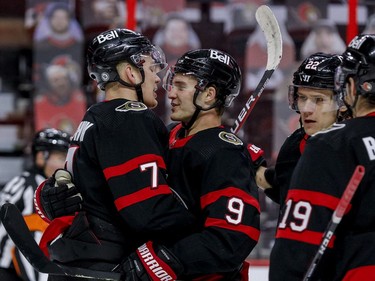 Ottawa Senators centre Josh Norris (9) is congratulated on his goal against the Vancouver Canucks by teammate left wing Brady Tkachuk (7) during first period NHL action at the Canadian Tire Centre.