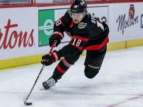 Ottawa Senators left wing Tim Stuetzle controls a loose puck against the Vancouver Canucks at the Canadian Tire Centre, April 16, 2021.