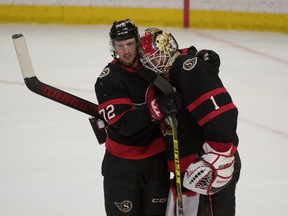 Ottawa Senators defenceman Thomas Chabot celebrates with goalie Marcus Hogberg after beating the Vancouver Canucks.