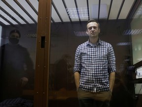 Russian opposition leader Alexei Navalny attends a hearing to consider an appeal against an earlier court decision to change his suspended sentence to a real prison term, in Moscow, Russia Feb. 20, 2021.