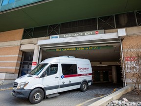 A medical transport van departs The Hospital for Sick Children, which has opened eight intensive care unit (ICU) beds for adults during the COVID-19 pandemic in Toronto, April 14, 2021.