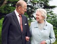 Queen Elizabeth and her husband, the Duke of Edinburgh, walk at Broadlands, Hampshire, in a photo released on November 18, 2007 to mark their diamond wedding anniversary.