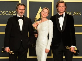 Left to right: Joaquin Phoenix, Renee Zellweger and Brad Pitt at the Oscars, Feb. 9, 2020