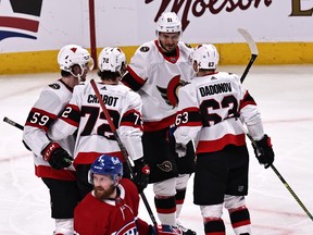 Ottawa Senators right wing Evgenii Dadonov (63) celebrates with teammates after scoring a goal against the Montreal Canadiens in the second period on Saturday night at the Bell Centre.