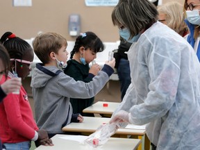 School children attend a COVID-19 saliva test in a primary school.