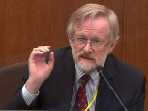 Chicago-based breathing expert Dr. Martin Tobin answers questions during the ninth day of the trial of former Minneapolis police officer Derek Chauvin for second-degree murder, third-degree murder and second-degree manslaughter in the death of George Floyd in Minneapolis, Minn., April 8, 2021 in a still image from video.
