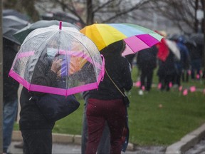 People line up for the COVID-19 vaccine pop-up clinic in Thorncliffe Park and Flemingdon Park community at the Masjid Darussalam Thorncliffe Mosque in Toronto on April 11, 2021.