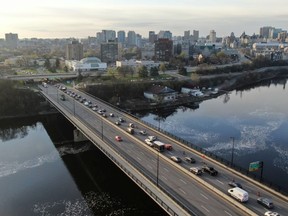 Cars are lined up along the McDonald Cartier bridge between Gatineau and Ottawa as the Ottawa Police Service screen travellers entering Ontario from Quebec in support of public health orders issued by the Government of Ontario.