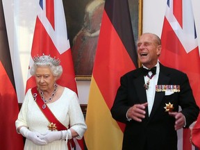 Queen Elizabeth and Prince Philip wait to greet guests prior to a state banquet at Bellevue presidential palace in Berlin, Germany June 24, 2015.