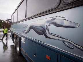 FILE: A Greyhound bus driver does a walk-around.