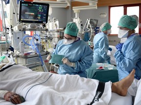 Medical workers work in the Intensive Care Unit (ICU) where patients suffering from the coronavirus disease (COVID-19).