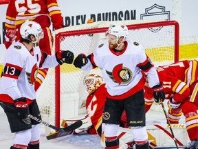 Ottawa Senators right wing Connor Brown (28) celebrates his goal with left wing Nick Paul (13) during the second period against the Calgary Flames at Scotiabank Saddledome on April 19. 2021.