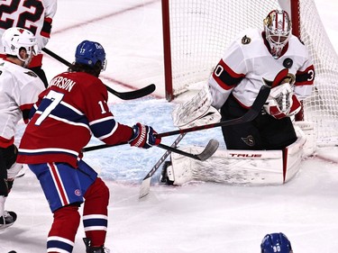 Ottawa Senators goaltender Matt Murray (30) makes a save against Montreal Canadiens right wing Josh Anderson (17) as defenceman Artem Zub (2) defends during the second period at Bell Centre.