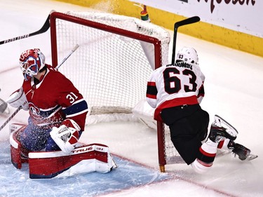 Ottawa Senators right wing Evgenii Dadonov (63) crashes into Montreal Canadiens goaltender Carey Price (31) net during the first period at Bell Centre.