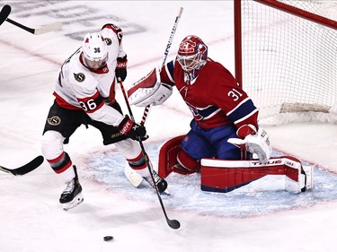 Ottawa Senators centre Colin White (36) plays the puck in front of Montreal Canadiens goaltender Carey Price (31) during the first period at Bell Centre.