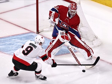 Montreal Canadiens goaltender Carey Price (31) clears the puck in front of Ottawa Senators centre Josh Norris (9) during the first period at Bell Centre on Saturday.