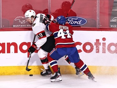 Montreal Canadiens right wing Paul Byron (41) and Ottawa Senators left wing Jack Kopacka (59) battle for the puck during the first period at Bell Centre.