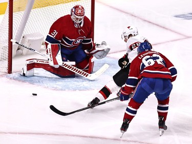 Ottawa Senators right wing Connor Brown (28)  shoots the puck against Montreal Canadiens goaltender Carey Price (31) as left wing Artturi Lehkonen (62) defends during the second period at Bell Centre.