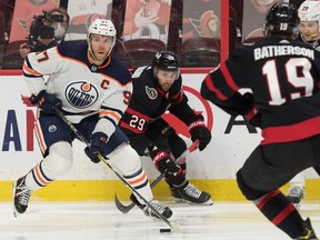 Edmonton Oilers centre Connor McDavid (97) skates with the puck ahead of Ottawa Senators centre Michael Amadio (29) during the second period at the Canadian Tire Centre.