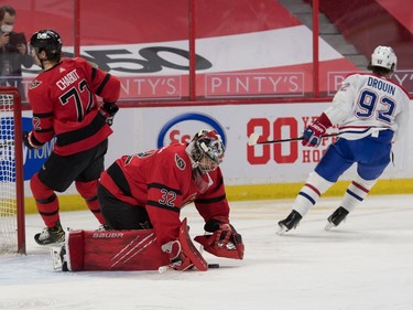 Ottawa Senators goalie Filip Gustavsson (32) makes a save on a shot from Montreal Canadiens left wing Jonatahan Droin (92) in the first period at the Canadian Tire Centre.