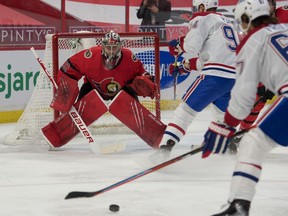 File photo/ Montreal Canadiens right wing Michael Frolik (67) shoots on Ottawa Senators goalie Filip Gustavsson (32) in the first period at the Canadian Tire Centre.