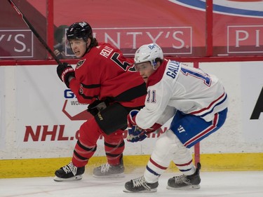 Ottawa Senators defenseman Mike Reilly (5) and Montreal Canadiens right wing Brendan Gallagher (11) chase the puck in the first period at the Canadian Tire Centre.