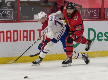 Montreal Canadiens defenseman Brett Kulak (77) battles with Ottawa Senators center Clark Bishop (62) in the second period at the Canadian Tire Centre.