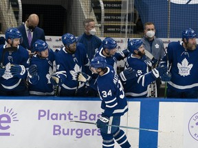 Apr 10, 2021; Toronto, Ontario, CAN; Toronto Maple Leafs center Auston Matthews (34) celebrates at the bench after scoring a third goal against the Ottawa Senators during the second period at Scotiabank Arena. Mandatory Credit: Nick Turchiaro-USA TODAY Sports ORG XMIT: IMAGN-445555