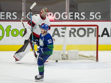 Vancouver Canucks forward Bo Horvat (53) celebrates a goal scored by forward Tanner Pearson (70) on Ottawa Senators goalie Marcus Hogberg (1) in the third period at Rogers Arena. Canucks won 4-2.