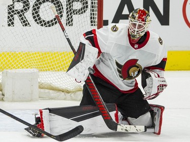 Ottawa Senators goalie Marcus Hogberg (1) makes a save against the Vancouver Canucks  in the third period at Rogers Arena. Canucks won 4-2.
