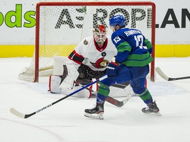 Ottawa Senators goalie Marcus Hogberg (1) makes a save on Vancouver Canucks forward Jayce Hawryluk (13) in the third period at Rogers Arena. Canucks won 4-2.