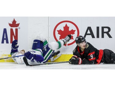 Ottawa Senators centre Josh Norris and Vancouver Canucks centre Tyler Motte are both on the ice following a collision during the third period.
