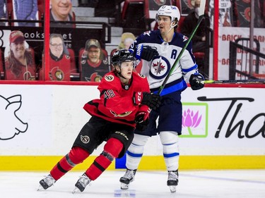 Ottawa Senators defenceman Jacob Bernard-Docker (48) and Winnipeg Jets centre Mark Scheifele (55) during the third period.